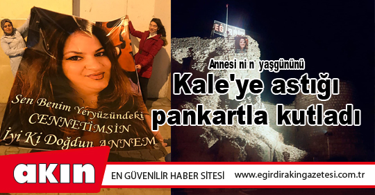 Annesinin yaşgününü Kale'ye astığı pankartla kutladı